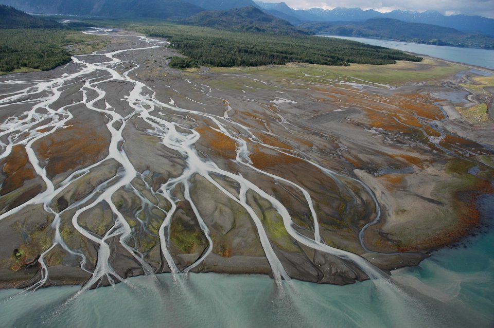 Braided river delta with red & green lora at low tide Lower Cook Inlet Kachemak Bay Alaska