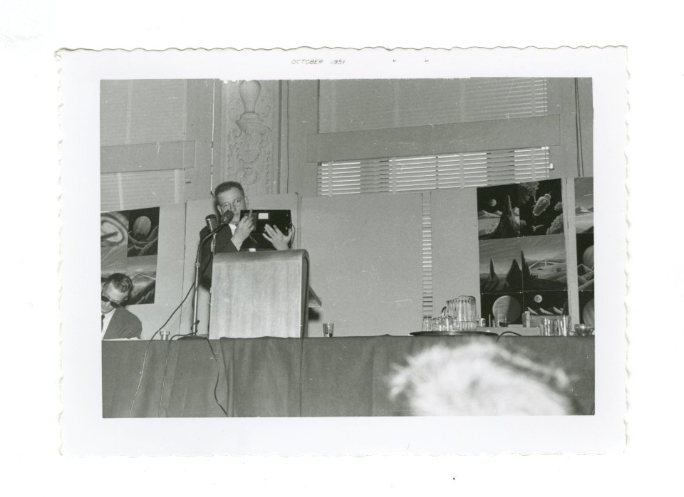 John Campbell at podium: 14th World Science Fiction Convention, 1956. Image # WSFS 006