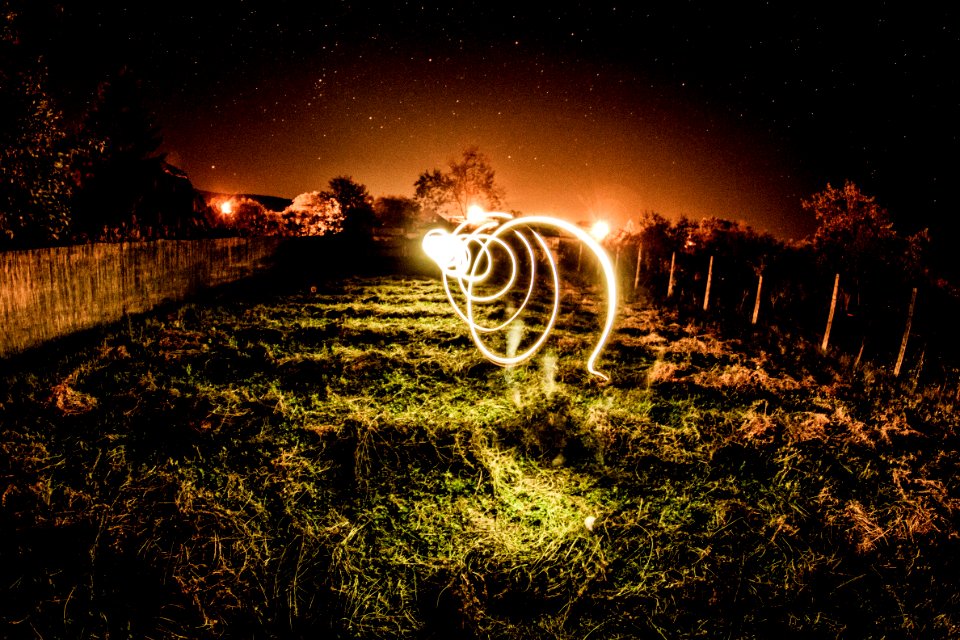 playing with lights at fisheye under stars photo