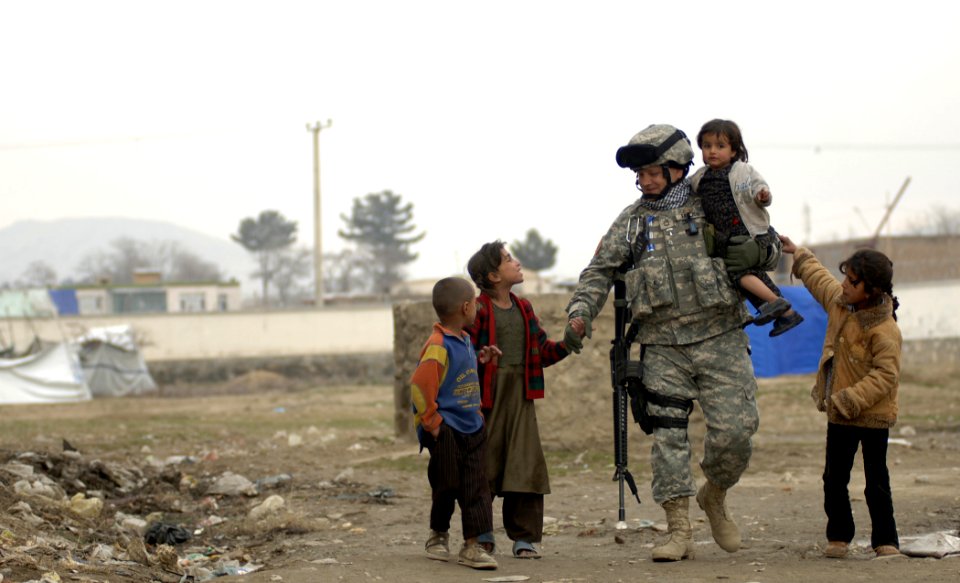 Public Domain: Soldier with Refugee Children by Cecilio M. Ricardo Jr. USAF, April 2007 (DOD 070408-F-3961R-900)