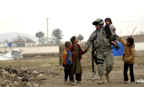 Public Domain: Soldier with Refugee Children by Cecilio M. Ricardo Jr. USAF, April 2007 (DOD 070408-F-3961R-900) photo