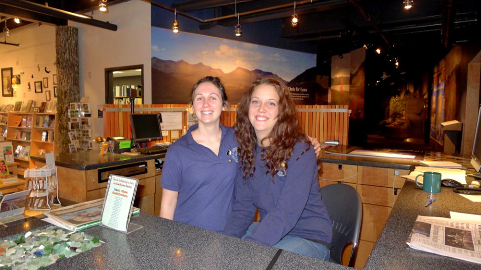 Volunteers at the information desk of Kodiak Refuge Visitor Center photo