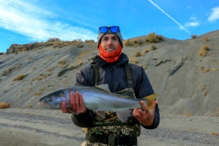 Angler holds Lahontan cutthroat trout at Pyramid Lake photo