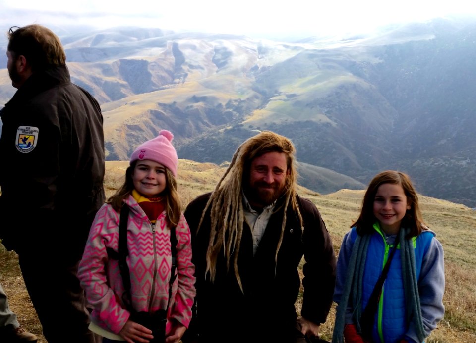 Celia (left) and Emmie (right), members of Pasadena Young Birders Club, with condor biologist Joseph Brandt. Photo by Kristy Clougherty