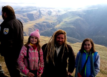 Celia (left) and Emmie (right), members of Pasadena Young Birders Club, with condor biologist Joseph Brandt. Photo by Kristy Clougherty