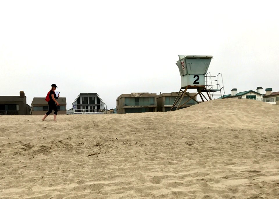 Andrea Dransfield, a BeachCOMBERS volunteer, surveys Silver Strand beach.