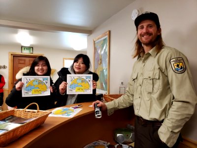 Tourists show off certificates