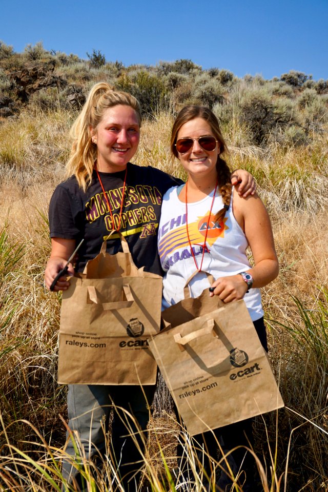Interns Madeline Esterl and Sophia Heston at Sheldon NWR collecting seeds