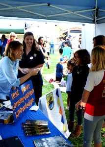 Ojai, Calif. (March 18, 2017) - Ventura Fish and Wildlife Office public affairs officer Ashley Spratt tests a visitor's conservation knowledge during an event at the Libbey Bowl celebrating women in science, and longtime condor advocate Jan Hamber.