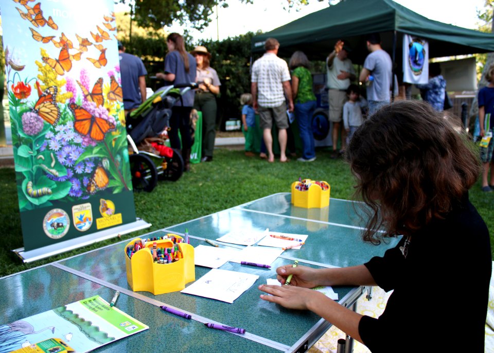 Ojai, Calif. (March 18, 2017) - A young visitor colors a seed packet to hold native pollinator seeds during an event at the Libbey Bowl celebrating women in science, longtime condor advocate Jan Hamber.