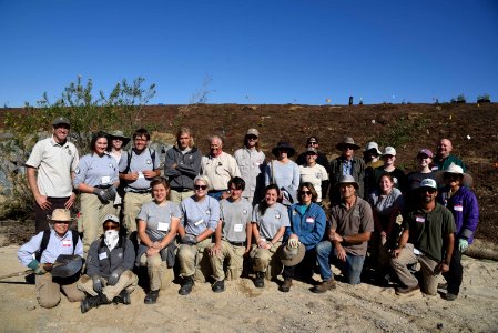 USFWS staff, AmeriCorps, Riverside County Flood Control, NRCS and a volunteer work together to cultivate native riparian plants along the Meadowview streambank in Temecula, California photo