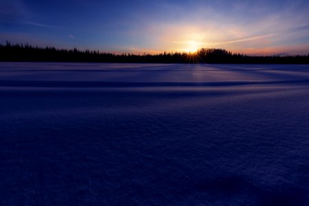 Sunrise over the snowy lake. photo