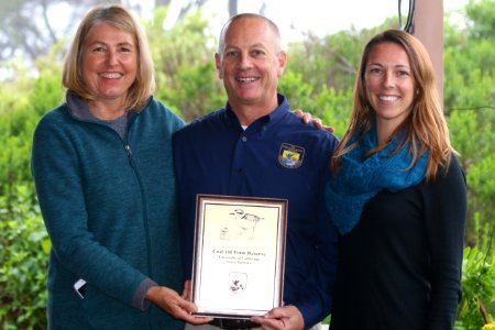 Cristina Sandoval, Director of Coal Oil Point Reserve, and Jessica Nielsen, conservation specialist, accept award from U.S. Fish and Wildlife Service for conservation of the federally threatened western snowy plover. photo