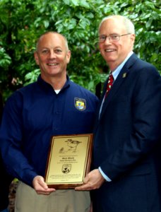 Santa Barbara Zoo CEO Rich Block accepts award from U.S. Fish and Wildlife Service Field Supervisor Steve Henry for Zoo's commitment to conservation of threatened and endangered native wildlife. photo