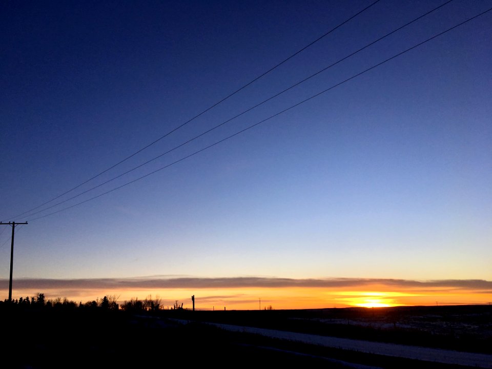 Roads, Wire Converge to the Sunset