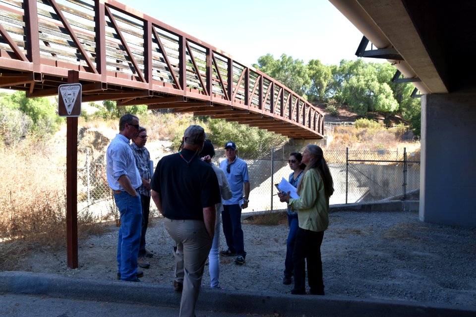 Several members of Steelhead Coalition at San Juan Creek watershed barrier at I-5 in Orange County.