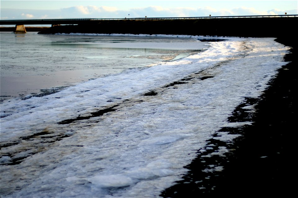 Icy Shore of Black Sand
