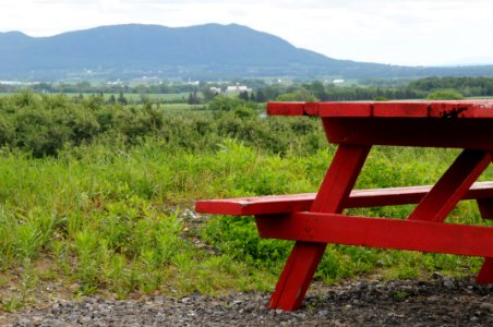 Red picnic table mountain landscape