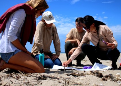 Lena Chang, right, senior fish and wildlife biologist with the Service in Ventura, and volunteer coordinator for the South Coast Chapter of BeachCOMBERS, discusses BeachCOMBERS protocol with future volunteers. photo