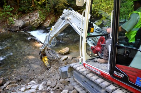 Citico Dam Removal in Region 4 - crane breaking apart the dam