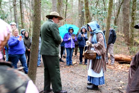 Volunteer Grant Palmer (as first superintendent Ross Eakin) with Ranger Jennifer Hale on the Christmas Memories Walk at the 2018 Festival of Christmas Past, December 8, 2018--Warren Bielenberg