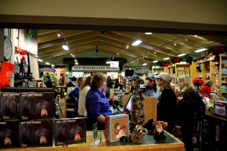 Great Smoky Mountains Association staff assists visitors in the bookstore at the 2018 Festival of Christmas Past, December 8, 2018--Warren Bielenberg