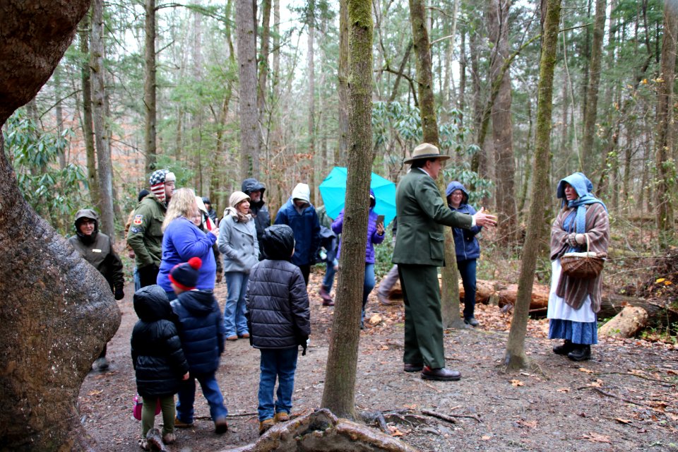 Volunteer Grant Palmer (as first superintendent Ross Eakin) with Ranger Jennifer Hale on the Christmas Memories Walk at the 2018 Festival of Christmas Past, December 8, 2018--Warren Bielenberg