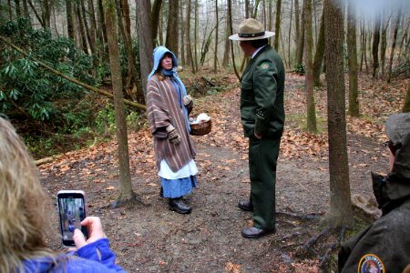 Volunteer Grant Palmer (as first superintendent Ross Eakin) with Ranger Jennifer Hale on the Christmas Memories Walk at the 2018 Festival of Christmas Past, December 8, 2018--Warren Bielenberg