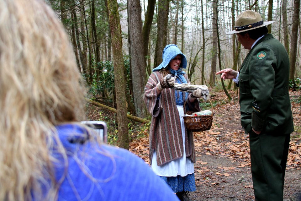 Volunteer Grant Palmer (as first superintendent Ross Eakin) with Ranger Jennifer Hale on the Christmas Memories Walk at the 2018 Festival of Christmas Past, December 8, 2018--Warren Bielenberg