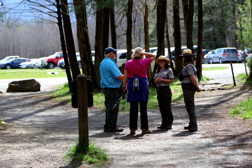 Resource Education Rangers Beth Bramhall and Lisa Nagurny talk with visitors at Abrams Falls Trailhead--Warren Bielenberg, April 2019