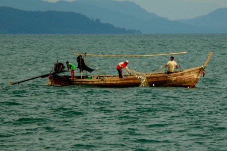 fisherman at sea of Thailand - phuket photo