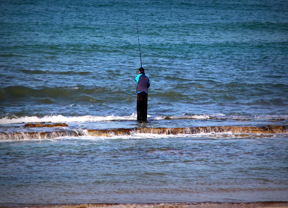 Fisherman on rocks -Hadera
