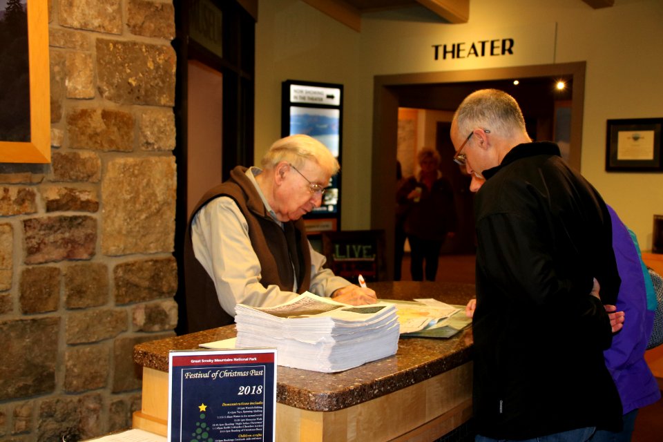 Volunteer Merwyn Borders assists visitors at the 2018 Festival of Christmas Past, December 8, 2018--Warren Bielenberg