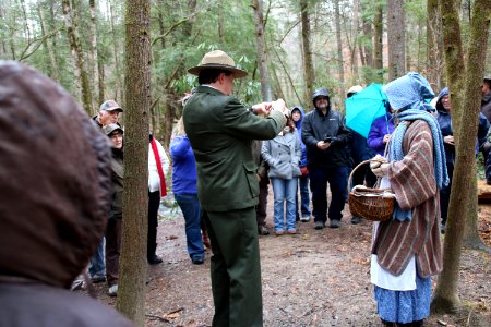 Volunteer Grant Palmer (as first superintendent Ross Eakin) with Ranger Jennifer Hale on the Christmas Memories Walk at the 2018 Festival of Christmas Past, December 8, 2018--Warren Bielenberg