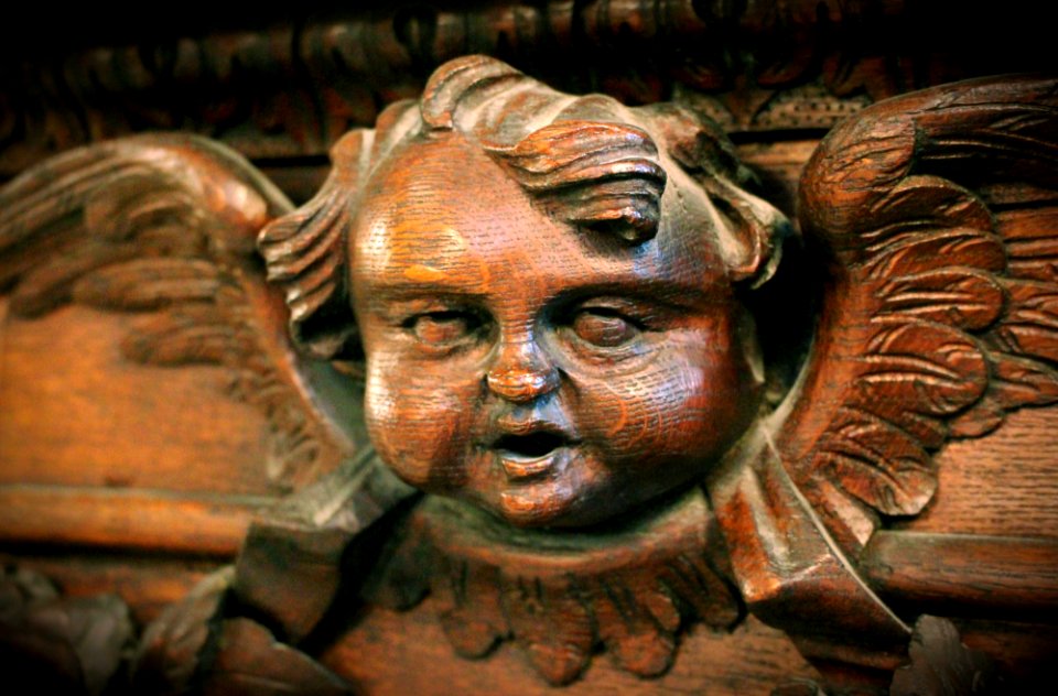 Creepy cherub rolling his eyes up into his head...!