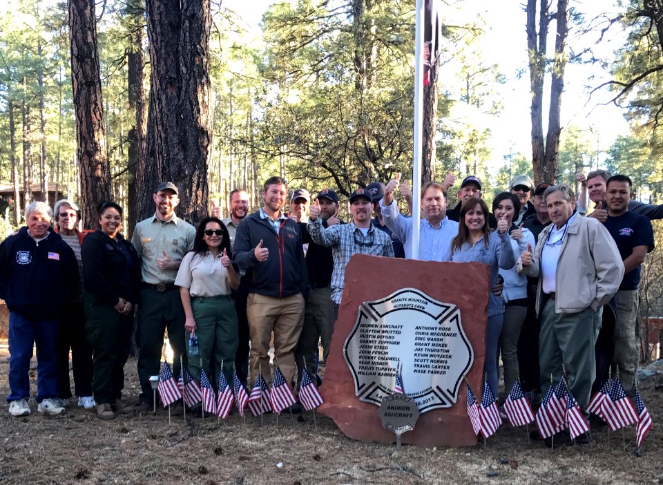 PAWUIC members gathering around a memorial
