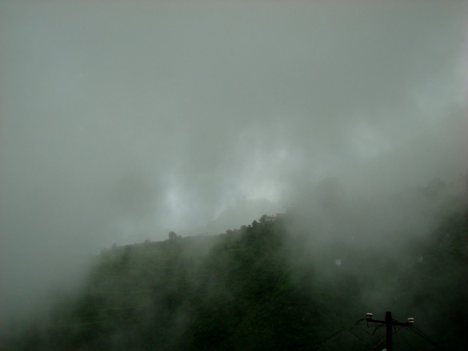 Clouds covering the hills