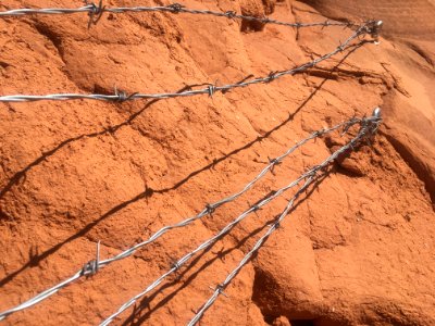 Barbed Wire Anchored in Sandstone
