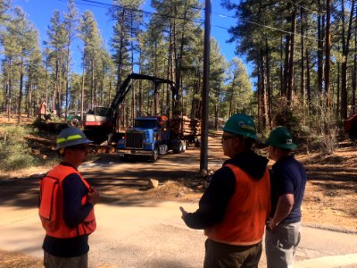 Three workers with a truck