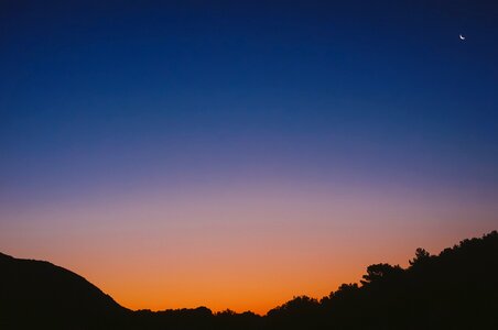 Sunset moon silhouette photo