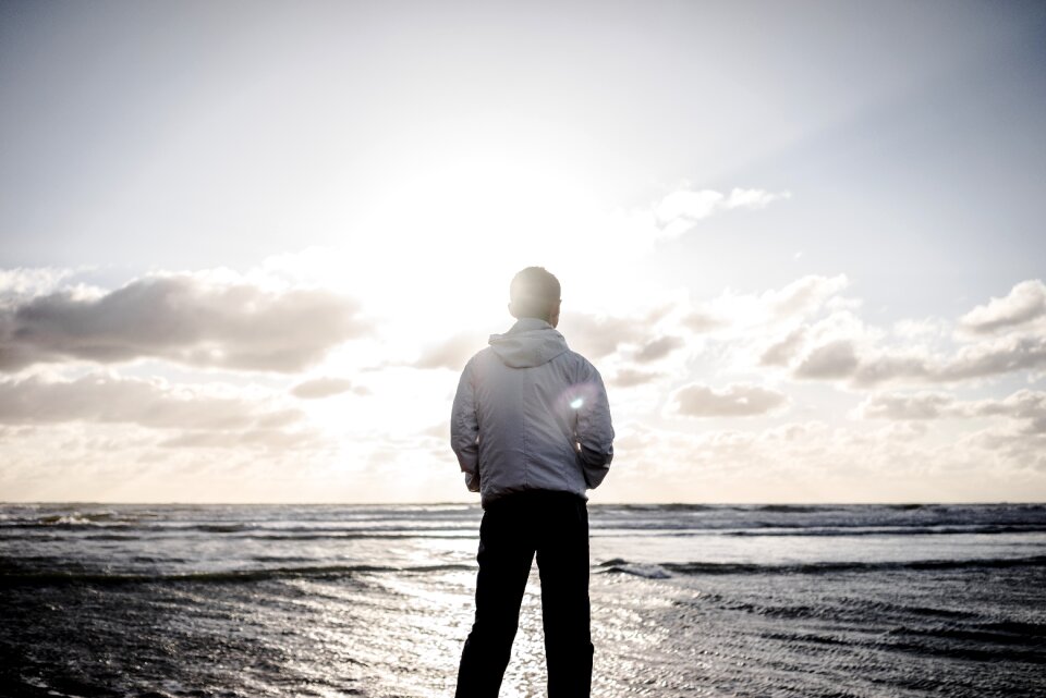Person sunset beach sea