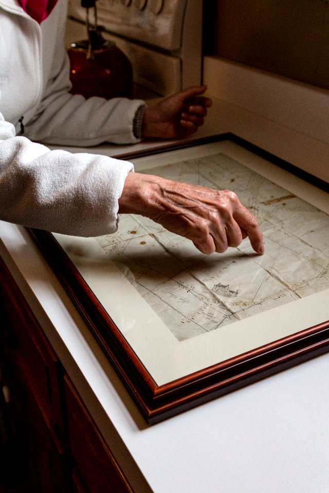Marilyn Spong shows Megan Lang (USFWS) an old map showing Viola farms property