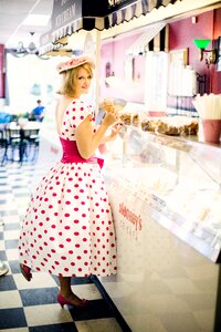 Pretty young woman vintage polka dot dress photo