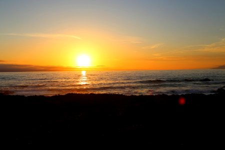 Sunset over the Pacific Ocean and the California Coastal National Monument viewed from the Piedras Blancas Light Station Outstanding Natural Area