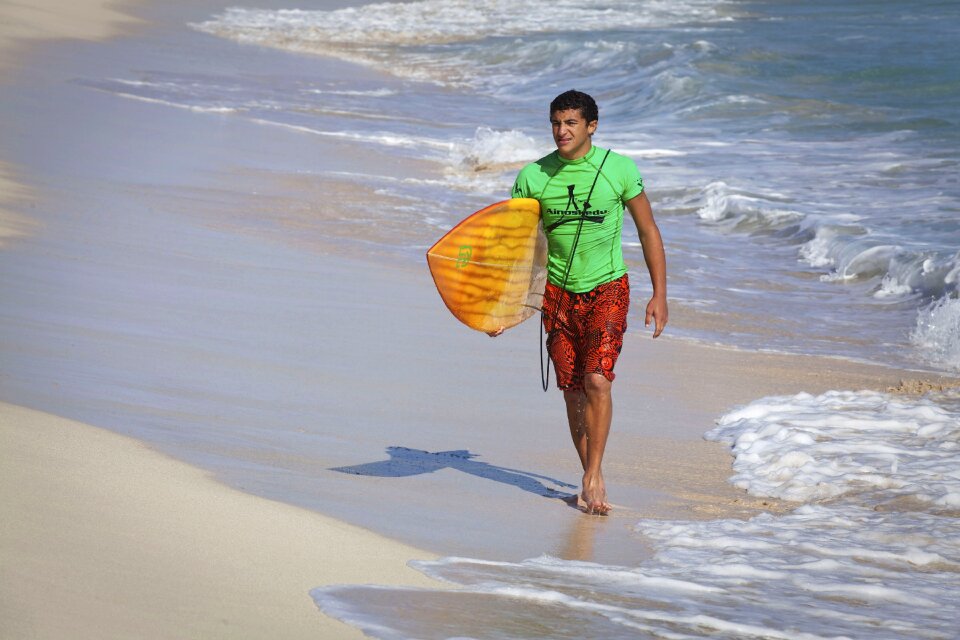 Walking surfing sea