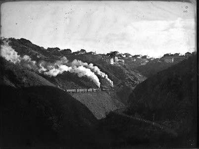 103; Two engines are being used to pull a train up an incline