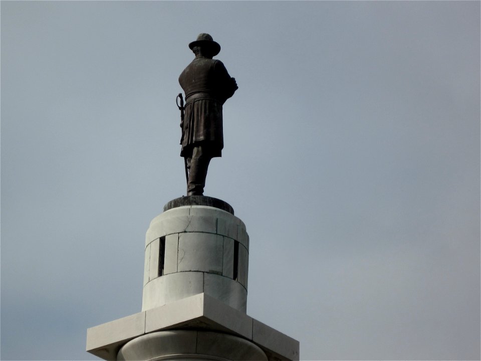 Quietly Watching Over the Parade Madness