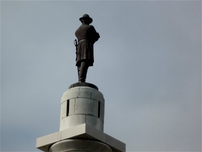 Quietly Watching Over the Parade Madness