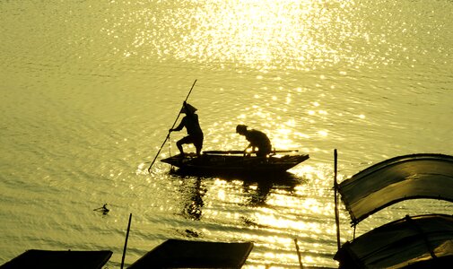 Catching fish sunset gold photo