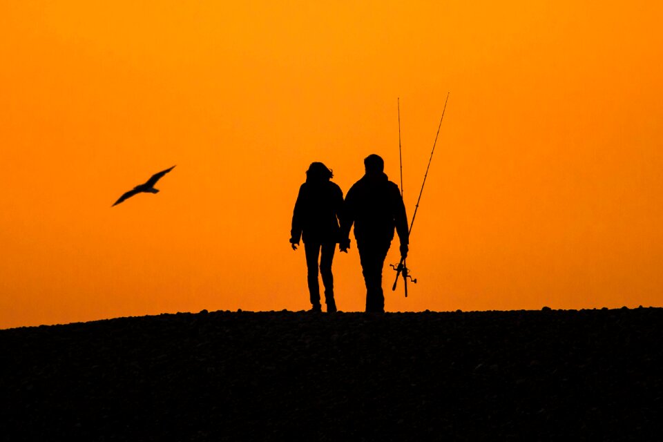 Beach silhouettes a couple of